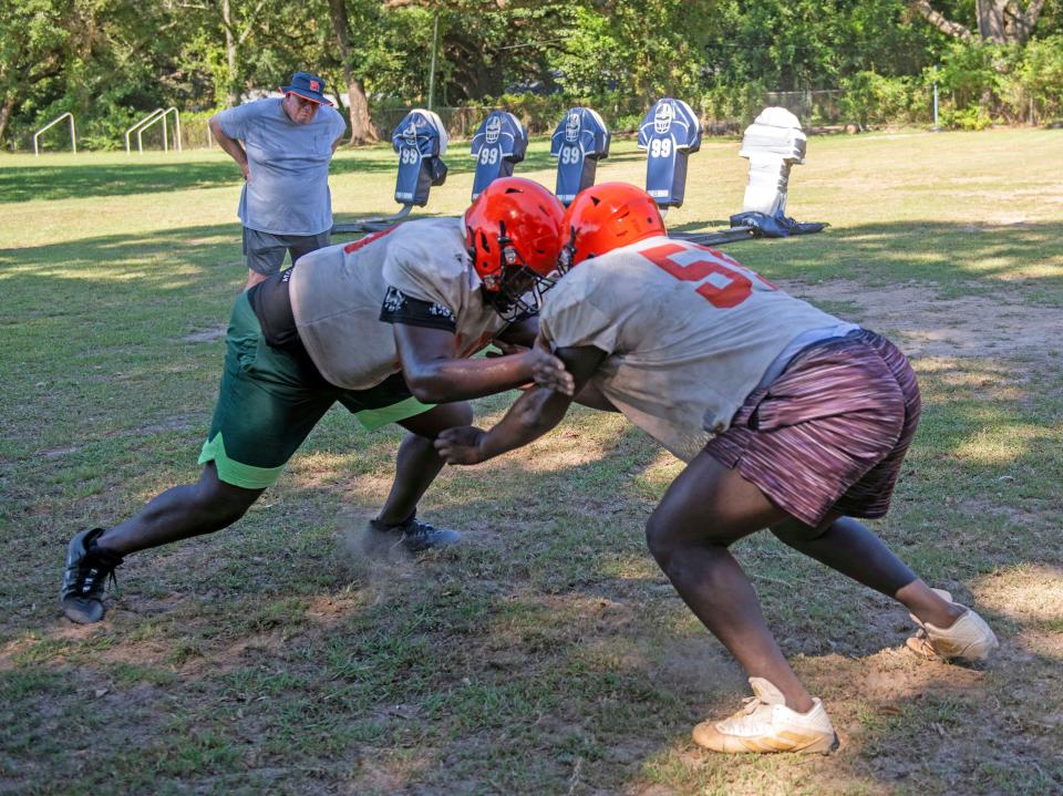 The Escambia High School coaching staff diligently prepares their team for the 2023 football season on Thursday, Aug. 10, 2023. 