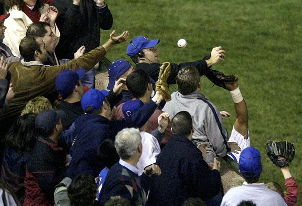 Chicago Cubs fan Steve Bartman interferes with left fielder Moises Alou's attempt to catch a foul ball during Game 6 of the National League Championship Series Chicago. (AP)