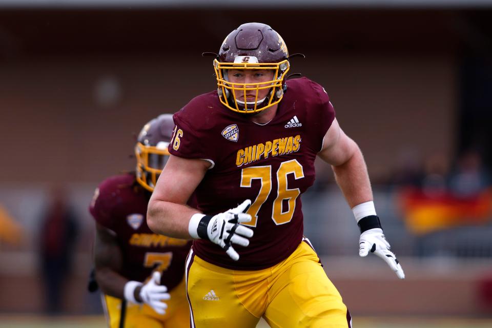 Central Michigan offensive lineman Bernhard Raimann plays during an NCAA college football game against Eastern Michigan, Friday, Nov. 26, 2021, in Mount Pleasant, Mich.