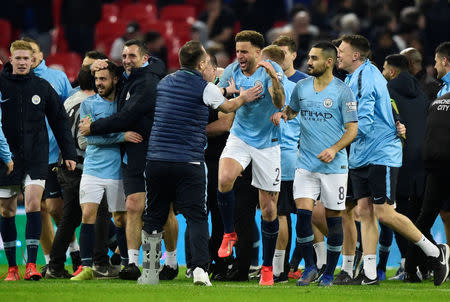 Soccer Football - Carabao Cup Final - Manchester City v Chelsea - Wembley Stadium, London, Britain - February 24, 2019 Manchester City's Kyle Walker, Ilkay Gundogan and team mates celebrate after winning the penalty shootout REUTERS/Rebecca Naden