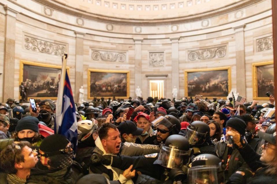 WASHINGTON D.C., USA - JANUARY 6: Police intervenes in US President Donald Trumps supporters who breached security and entered the Capitol building in Washington D.C., United States on January 06, 2021. Pro-Trump rioters stormed the US Capitol as lawmakers were set to sign off Wednesday on President-elect Joe Biden's electoral victory in what was supposed to be a routine process headed to Inauguration Day. (Photo by Mostafa Bassim/Anadolu Agency via Getty Images)