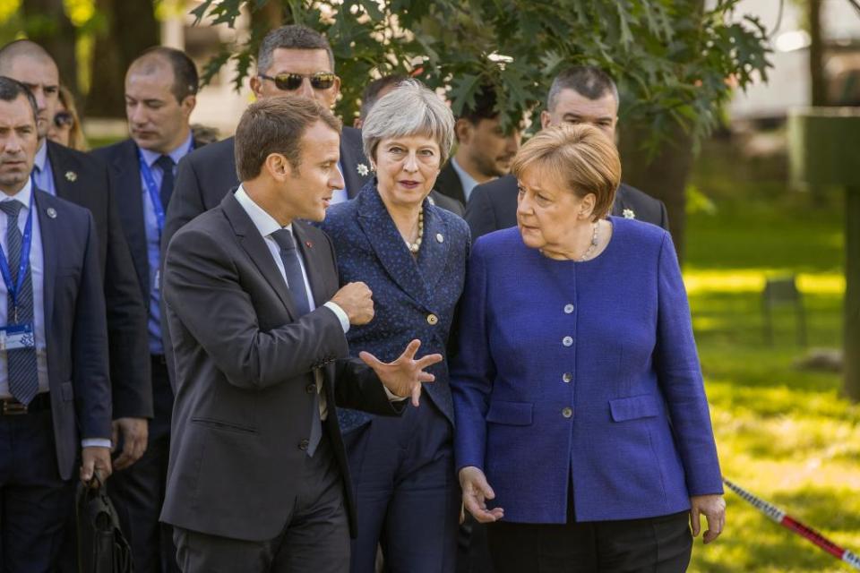 Theresa May with Emmanuel Macron, president of France and Angela Merkel, chancellor of Germany