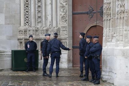 Armed French police take position outside the Cathedral in Rouen, France, during a funeral service in memory of slain French parish priest Father Jacques Hamel at the Cathedral in Rouen, France, August 2, 2016. REUTERS/Jacky Naegelen