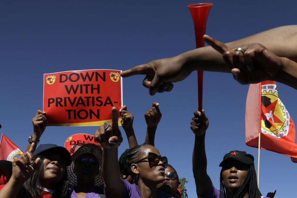 South African Cabin Crew Association and the National Union of Metalworkers of South Africa members picket at the SAA Airways Park in Kempton Park, South Africa, Friday, Nov. 15, 2019. South Africa's troubled state-owned airline has begun canceling flights after two unions announced their workers would go on strike to protest nearly 1,000 expected job cuts. (AP Photo/Themba Hadebe)