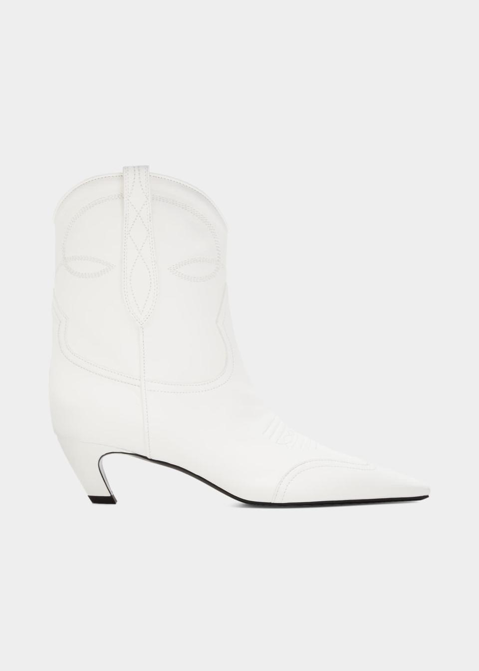 <p><strong>Khaite</strong></p><p>bergdorfgoodman.com</p><p><strong>$990.00</strong></p><p>The key to nailing the "wearing white after Labor Day look" lies in these sleek calfskin leather ankle boots that provide a smidge of height with curved kitten heels. </p>