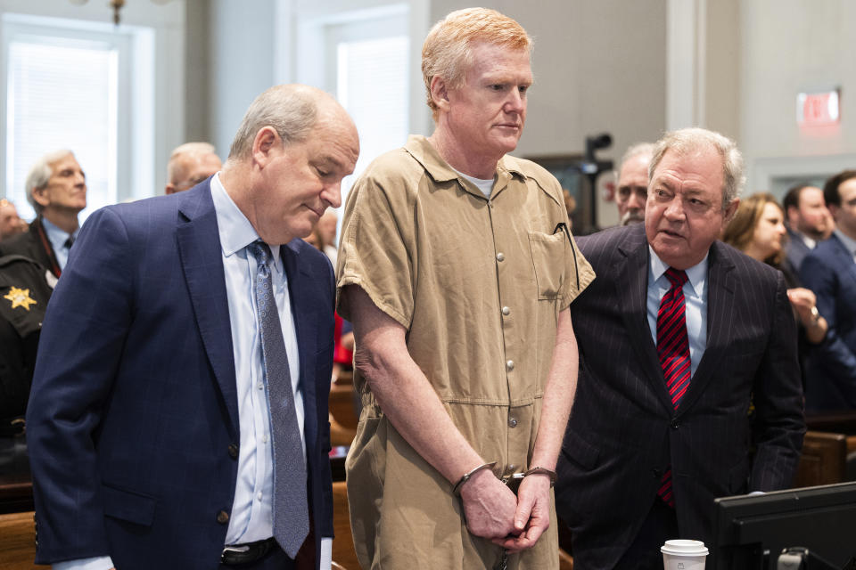 FILE - Alex Murdaugh speaks with his legal team before he is sentenced to two consecutive life sentences for the murder of his wife and son by Judge Clifton Newman at the Colleton County Courthouse on Friday, March 3, 2023 in in Walterboro, S.C. Convicted murderer Murdaugh is facing federal charges for the first time after being indicted on 22 financial fraud charges related to schemes the former attorney used to steal settlement money from clients. (Joshua Boucher/The State via AP, Pool, File)