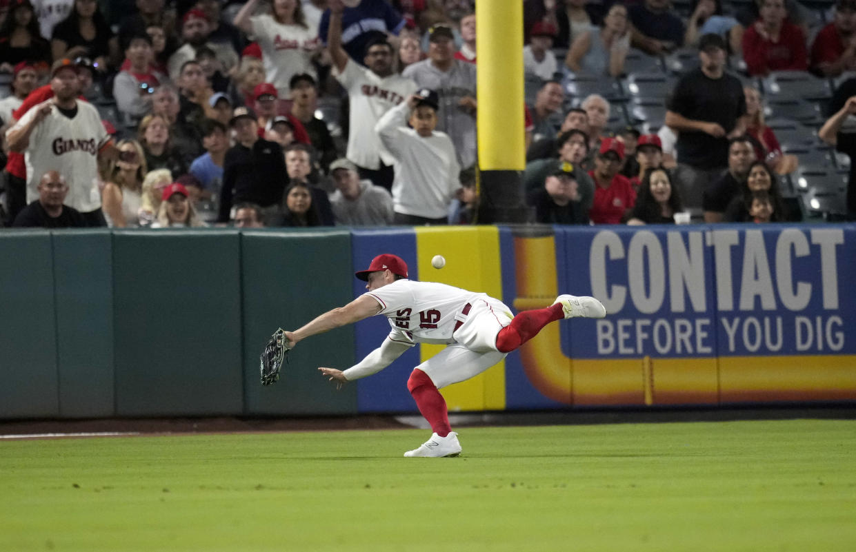 ANAHEIM, CALIFORNIA - AUGUST 7: Randal Grichuk #15 of the Los Angeles Angels fails to deny a two-run double by Patrick Bailey #14 of the San Francisco Giants during the ninth inning at Angel Stadium of Anaheim on August 7, 2023 in Anaheim, California. (Photo by Kevork Djansezian/Getty Images)