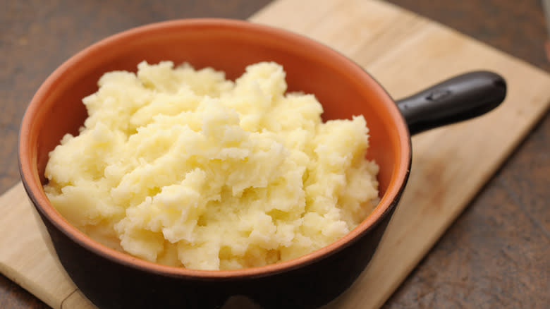 Mashed potatoes in brown crock