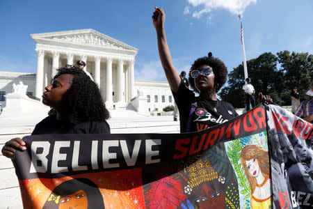 Activists hold a protest and rally in opposition to U.S. Supreme Court nominee Brett Kavanaugh outside the court in Washington, U.S., October 4, 2018. REUTERS/Kevin Lamarque