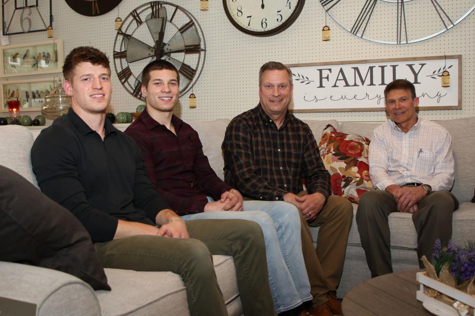 From left, Sam and JAK work alongside their dad, Paul Kohler, center, and uncle Matt Kohler, right, at Veh and Son Furniture in Gibsonburg.