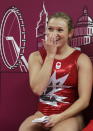 Canada's Rosannagh Maclennan reacts after seeing her score for the finals of the women's trampoline at the 2012 Summer Olympics, Saturday, Aug. 4, 2012, in London. (AP Photo/Gregory Bull)