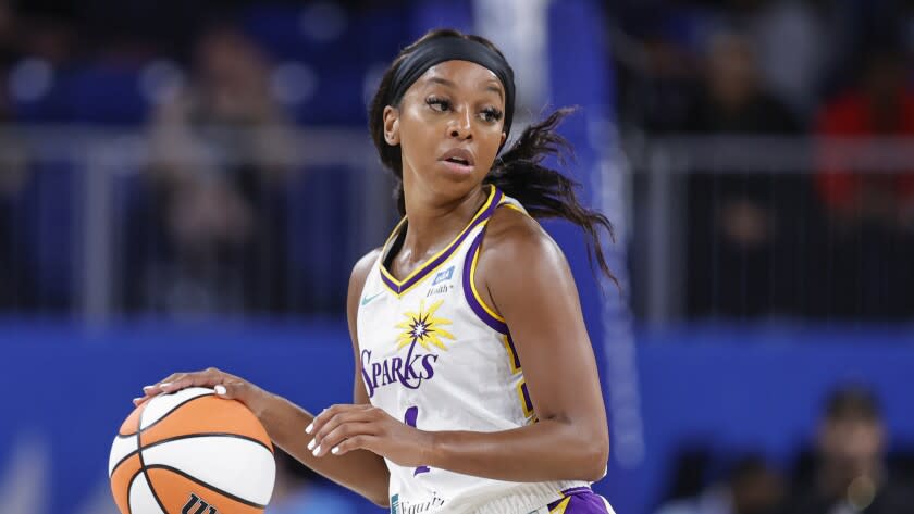 Los Angeles Sparks guard Lexie Brown brings the ball up court against the Chicago Sky during the first half of the WNBA basketball game, Friday, May 6, 2022, in Chicago. (AP Photo/Kamil Krzaczynski)