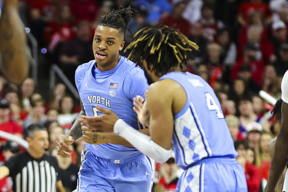 Feb 19, 2023; Raleigh, North Carolina, USA; North Carolina Tar Heels forward Armando Bacot (5) runs down the court after scoring a basket during the first half of the game against North Carolina State Wolfpack at PNC Arena. Mandatory Credit: Jaylynn Nash-USA TODAY Sports