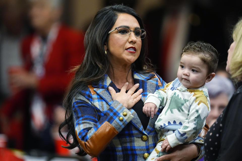 U.S. Rep. Lauren Boebert, D-Colo., holds her grandson Josiah while taking part in a meet-and-greet before the first Republican primary debate for the 4th Congressional district seat being vacated by Ken Buck Thursday, Jan. 25, 2024, in Fort Lupton, Colo. (AP Photo/David Zalubowski)