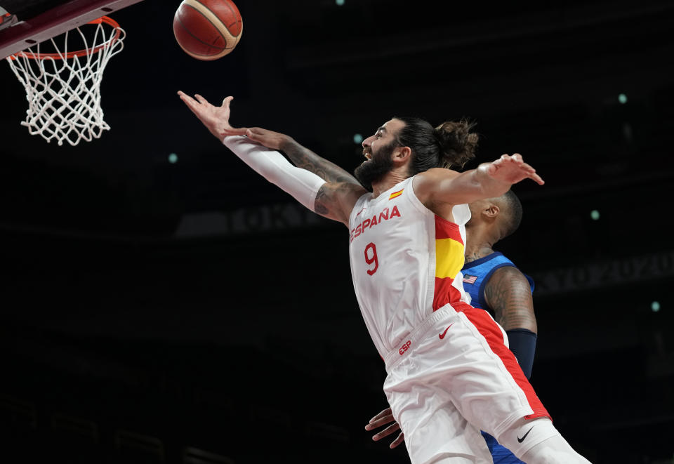 United States' Damian Lillard (6), rear, and Spain's Ricky Rubio (9) fight for the ball during men's basketball quarterfinal game at the 2020 Summer Olympics, Tuesday, Aug. 3, 2021, in Saitama, Japan. (AP Photo/Eric Gay)