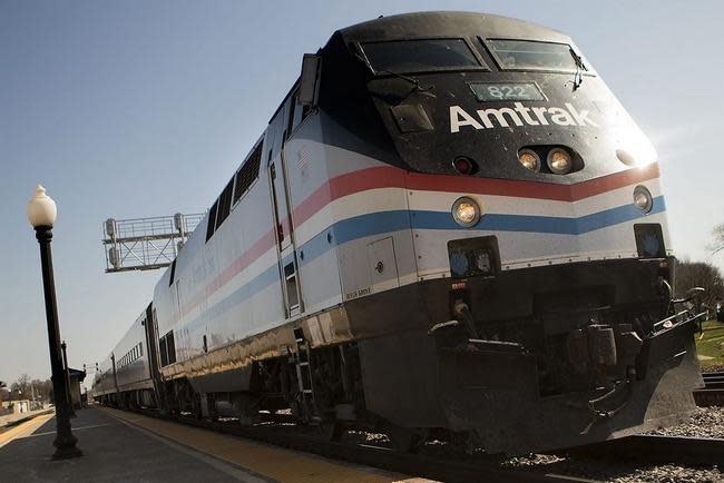 An Amtrak train passes through the Galesburg Amtrak station.