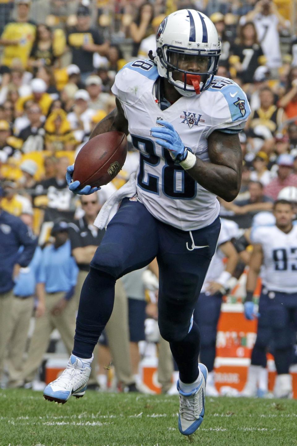 FILE - In this Sept. 8, 2013 file photo, Tennessee Titans running back Chris Johnson (28) runs during the third quarter of an NFL football game against the Pittsburgh Steelers in Pittsburgh. The Titans have told Chris Johnson they are releasing him after six seasons to avoid paying the $8 million the running back is due in pay in 2014, and the final three seasons left on the $53.5 million contract he signed in September 2011. The Titans announced Johnson has been told he will be released Friday, April 4, 2014. (AP Photo/Gene J. Puskar, File)