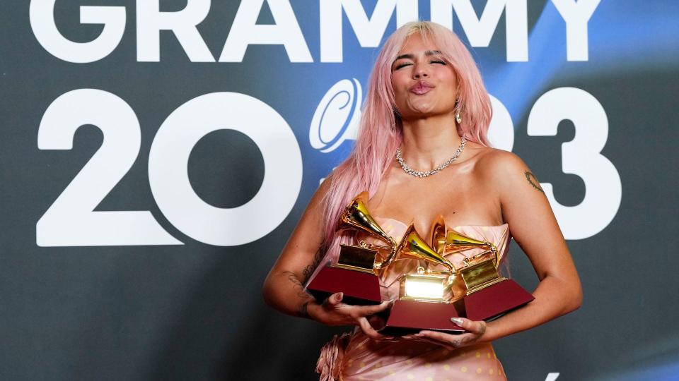 Karol G poses with the awards for best urban album for "Mañana Sera Bonito", for album of the year for "Mañana Sera Bonito" and the award for best urban fusion/performance for "TQG" during the 24th annual Latin Grammy Awards in Seville, Spain, Thursday, Nov. 16, 2023.