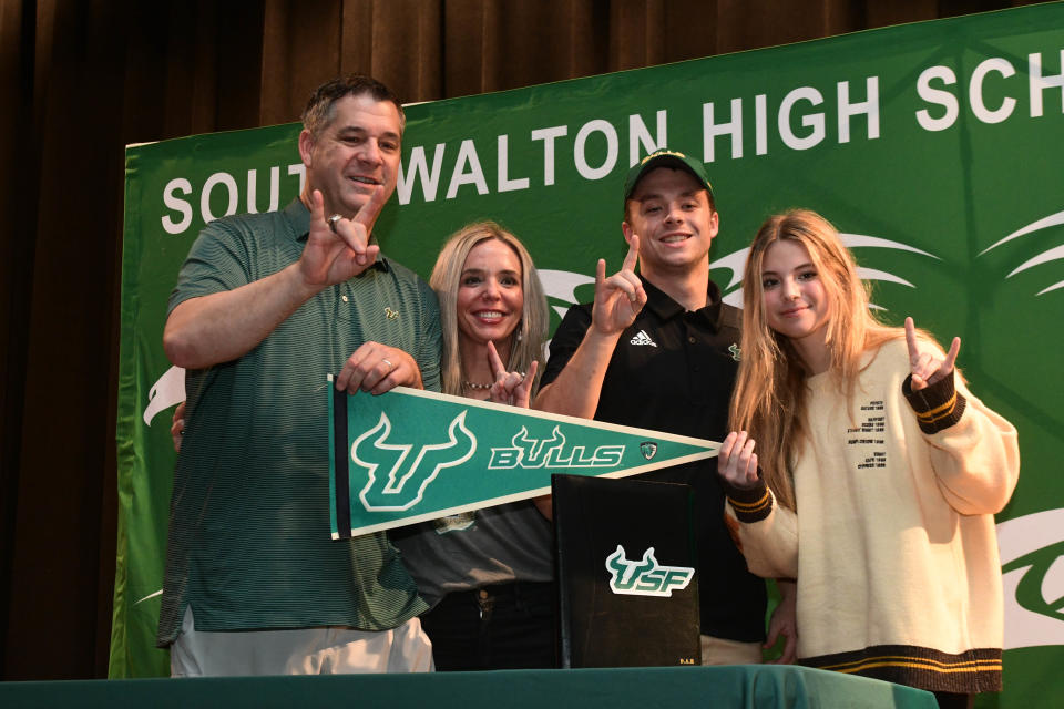 South Walton’s Cade Roberts poses for a picture with parents Dave and Courtney and sister Libby following a signing ceremony Wednesday where he committed to play for the University of South Florida.