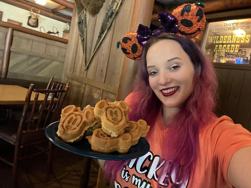 the writer holding a tray of mickey waffles at trail's end