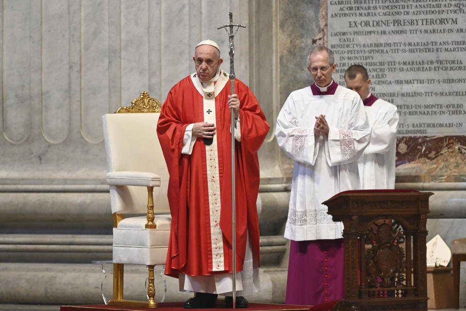 Pope Francis celebrates Palm Sunday Mass behind closed doors in St. Peter's Basilica, at the Vatican, Sunday, April 5, 2020, during the lockdown aimed at curbing the spread of the COVID-19 infection, caused by the novel coronavirus. (AP Photo/pool/Alberto Pizzoli)