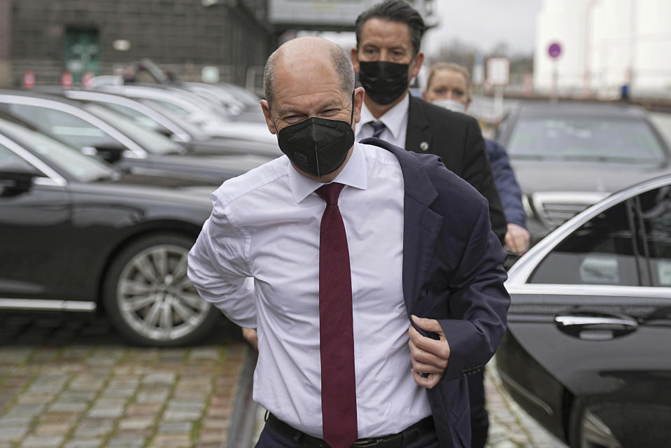 Olaf Scholz, SPD candidate for Chancellor and Federal Minister of Finance, arrives for the presentation of the coalition agreement, in Berlin, Wednesday, Nov. 24, 2021. The three parties negotiating to form Germany's next government will finalize and present their coalition agreement Wednesday, two of the prospective partners said. The deal paves the way for center-left leader Olaf Scholz to replace longtime Chancellor Angela Merkel in the coming weeks. (Michael Kappeler/dpa via AP)