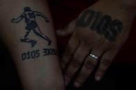 The Wider Image: Argentines celebrate 'eternal love' for Maradona with tattoos