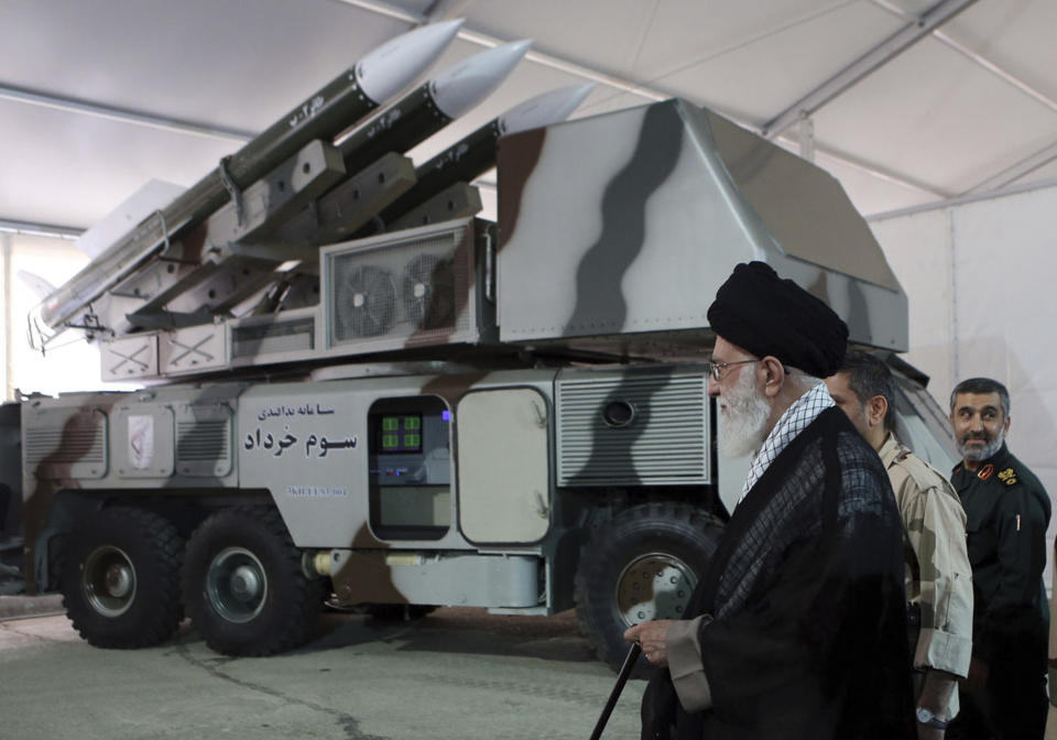 In this photo released on May 11, 2014, by an official website of the office of the Iranian supreme leader, Third of Khordad air defense system is displayed while Supreme Leader Ayatollah Ali Khamenei visits an exhibition of achievements of Revolutionary Guard's aerospace division, in Iran. Iran's Revolutionary Guard shot down a U.S. surveillance drone Thursday, June 20, 2019, in the Strait of Hormuz, marking the first time the Islamic Republic directly attacked the American military amid tensions over Tehran's unraveling nuclear deal with world powers. Iran said it has used its air defense system known as Third of Khordad to shoot down the drone — a truck-based missile system that can fire up to 18 miles (30 kilometers) into the sky. (Office of the Iranian Supreme Leader via AP)