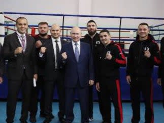 Vladimir Putin meeting boxing and kickboxing competitors in the Urals city of Perm in October (POOL/AFP via Getty Images)