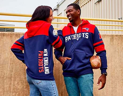 two people wearing team gear