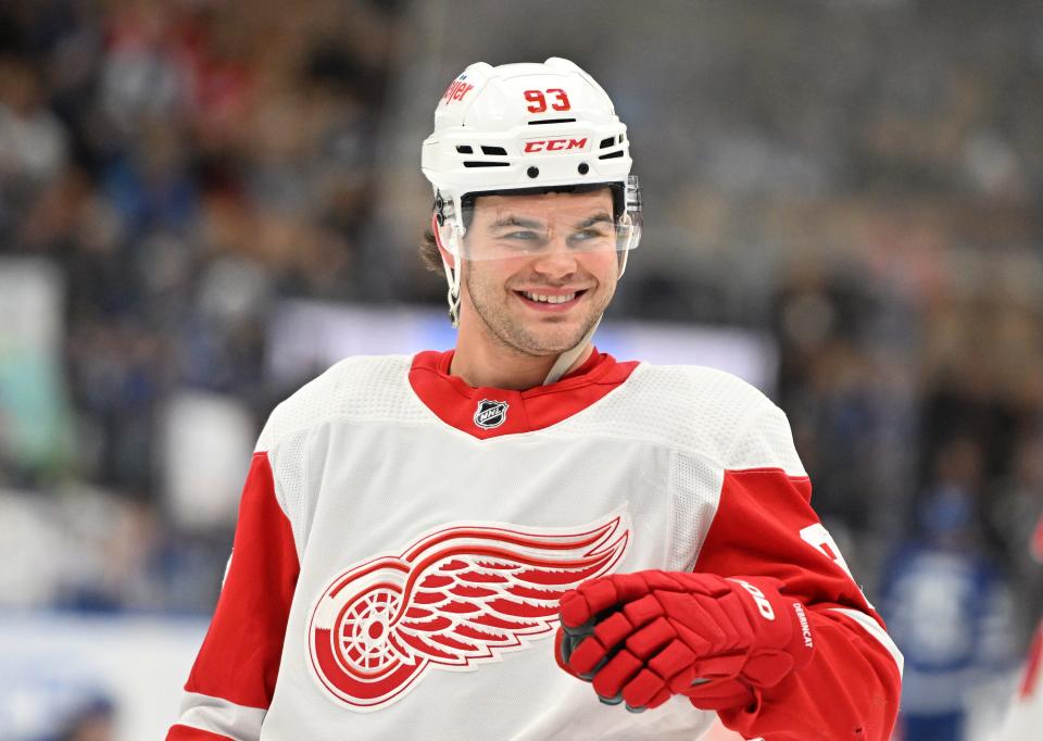 Detroit Red Wings forward Alex DeBrincat (93) speaks to a teammate in warm up before playing the Toronto Maple Leafs at Scotiabank Arena in Toronto on Sunday, Jan. 14, 2024.