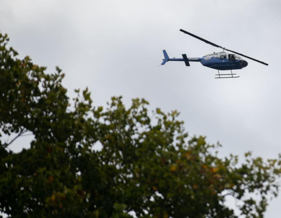 Members of law enforcement work the scene where Eliza Fletcher, 34, is believed to have been kidnapped around 4:30 a.m. on Friday, Sept. 2, 2022, near the corner Central Avenue and Zach H. Curlin Street. Police say Fletcher was jogging when she was forced into a dark-colored SUV. 