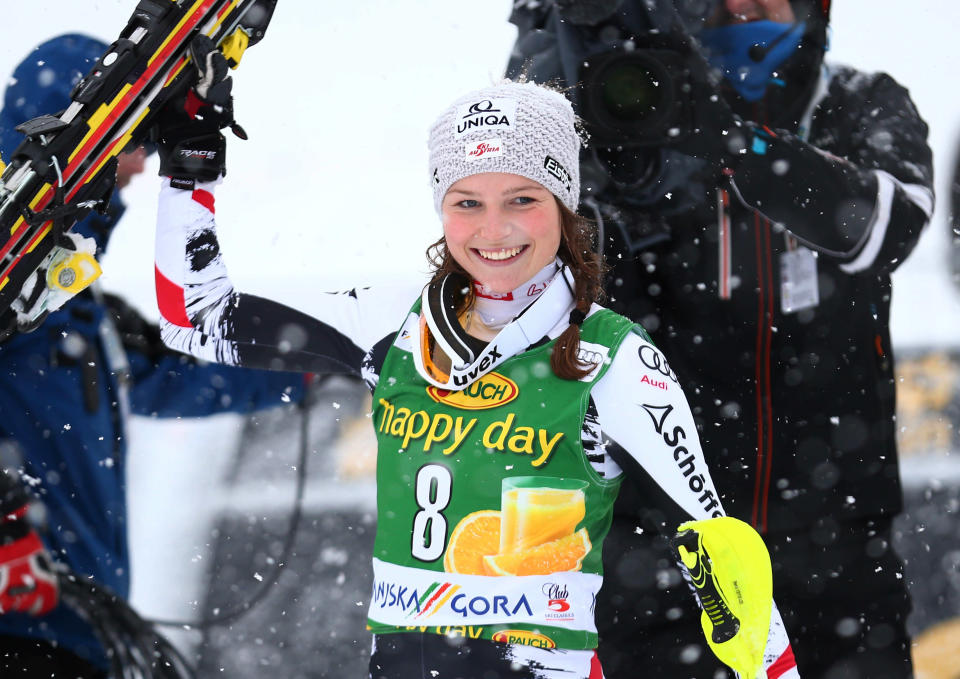 Bernadette Schild of Austria celebrates in the finish area after placing third at an alpine skiing women's Slalom in Kranjska Gora, Slovenia, Sunday, Feb. 2, 2014. (AP Photo/Giovanni Auletta)