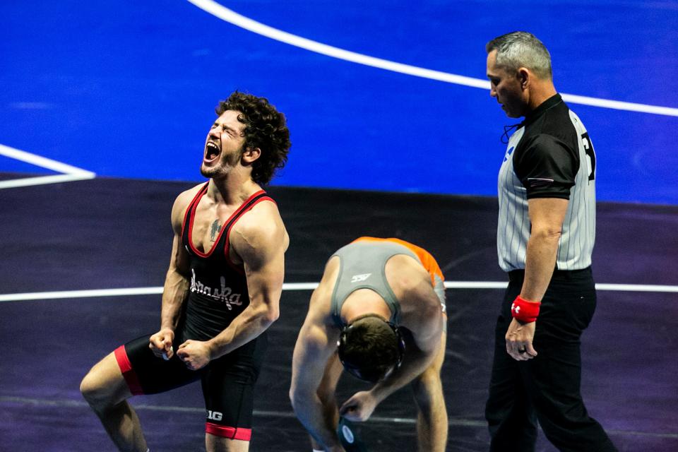 Nebraska's Liam Cronin, left, reacts after winning in sudden victory against Virginia Tech's Eddie Ventresca at 125 pounds in the quarterfianls during the third session of the NCAA Division I Wrestling Championships, Friday, March 17, 2023, at BOK Center in Tulsa, Okla.