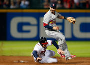 Daniel Descalso #33 of the St. Louis Cardinals attempts to turn a double play as Freddie Freeman #5 of the Atlanta Braves slides into second base as Dan Uggla #26 is safe at first in the eighth inning during the National League Wild Card playoff game at Turner Field on October 5, 2012 in Atlanta, Georgia. (Photo by Kevin C. Cox/Getty Images)