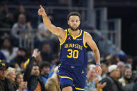 Golden State Warriors guard Stephen Curry celebrates after scoring a 3-point basket against the Houston Rockets during the first half of an NBA basketball game in San Francisco, Saturday, Dec. 3, 2022. (AP Photo/Godofredo A. Vásquez)