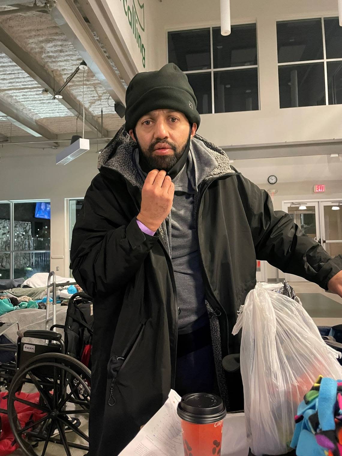 Malik Faisal Akram is seen checking in to OurCalling in Dallas the night of Jan. 2 when the center opened its door for emergency shelter in inclement weather.