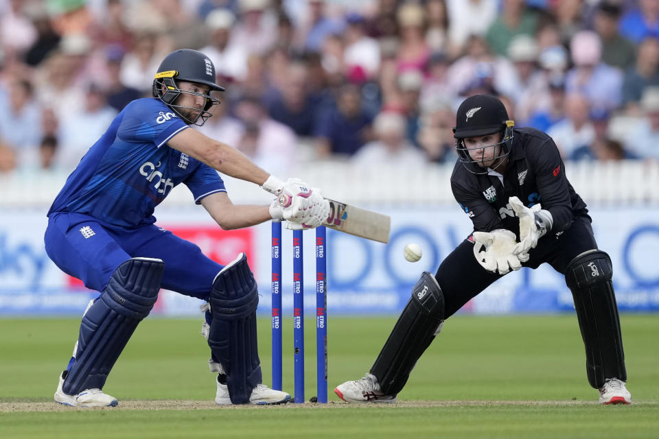 England's Dawid Malan plays a shot off the bowling of New Zealand's Rachin Ravindra during the One Day International cricket match between England and New Zealand at Lord's cricket ground in London, Friday, Sept. 15, 2023. (AP Photo/Kirsty Wigglesworth)