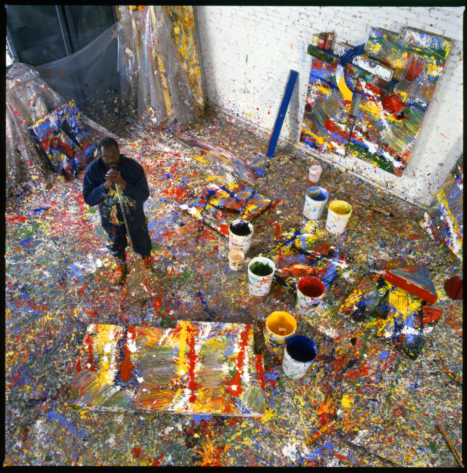 Portrait of American painter Sam Gilliam as he poses in his paint-splattered studio, Washington DC, 1980. / Credit: Getty Images