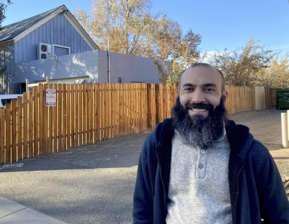 Daniel Echebarria, a 39-year-old supporter of President Donald Trump, poses for a picture in Carson City, Nev., where he works as a teacher. Echebarria lives in Sparks, Nev., and said he's disappointed and surprised in the results of the November election and isn't open to Joe Biden's message of unity after four years where he says Democrats prohibited the president from accomplishing his agenda by instead leaving him to fight the Russia investigation and impeachment. (AP Photo/Sam Metz)