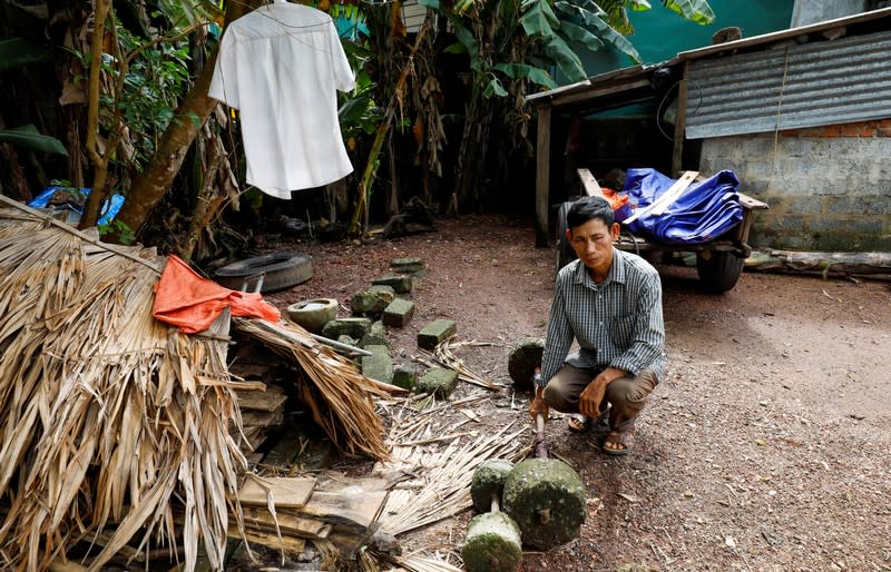 FILE PHOTO: JB Nguyen Dinh Gia shows a barbell which was used by his son Joseph Nguyen Dinh Luyen, a suspected victim of 39 deaths in a truck container in UK, at home in Ha Tinh province