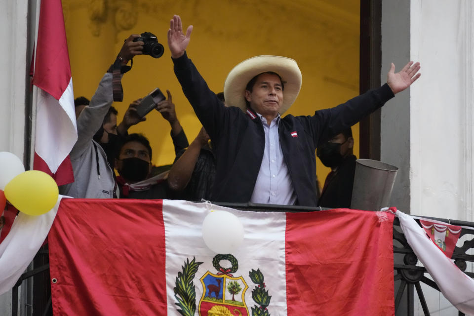 FILE - Then Presidential candidate Pedro Castillo waves to supporters celebrating partial election results at his campaign headquarters in Lima, Peru, June 7, 2021. Castillo was a rural schoolteacher in Peru’s third poorest district before he moved into the presidential palace. His only leadership experience before becoming president was as the head of a teachers’ strike in 2017. (AP Photo/Martin Mejia, File)