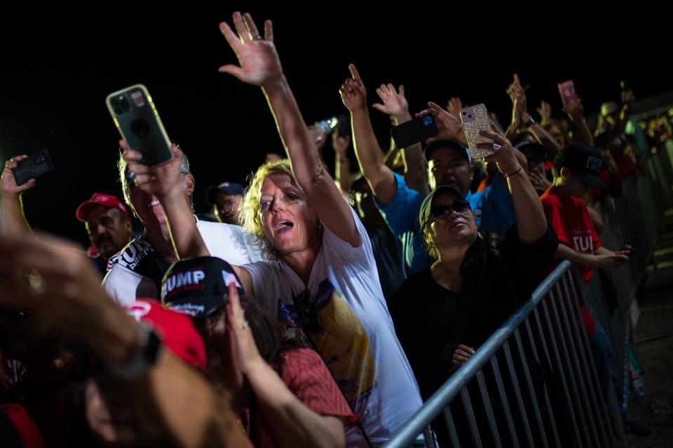 A woman cheers after closing remarks from former President Donald Trump at the Richard M. Borchard Regional Fairgrounds in Robstown, Texas on Saturday, Oct. 22, 2022.