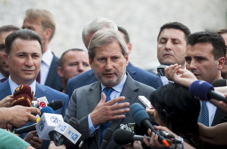 EU Enlargement Commissioner Johannes Hahn (C), Macedonian Prime Minister Nikola Gruevski (L) and main opposition leader Zoran Zaev (R) speak to the media in Skopje on June 2, 2015