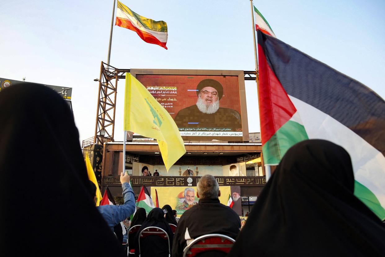 People gather in the Imam Hussein square in Tehran, Iran, during the televised speech of Lebanon-based Hezbollah chief Hassan Nasrallah on Nov. 3, 2023. Nasrallah told the U.S. his Iran-backed group was ready to face its warships and the way to prevent a regional war was for Israel halt its attacks in Gaza.