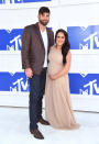 <p>The <i>Teen Mom </i>star, who recently announced that she’s expecting her third child, walked the red carpet in a nude chiffon gown with an empire waist, cradling her stomach. She also displayed some PDA with boyfriend David Eason. <i>(Photo: Getty Images)</i></p>