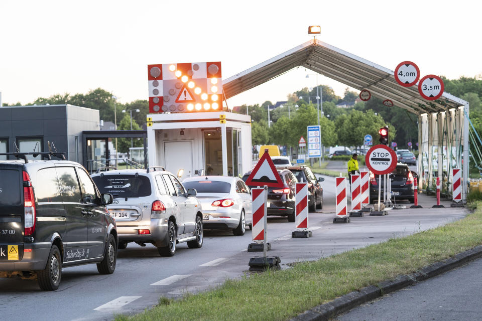 Vehicles queue at the border crossing in Krusaa, Denmark, after Denmark reopened its borders to Germany Monday, June 15, 2020, following the new coronavirus pandemic. (Claus Fisker/Ritzau Scanpix via AP)