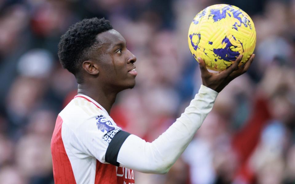 Eddie Nketiah holds the ball up to the crowd