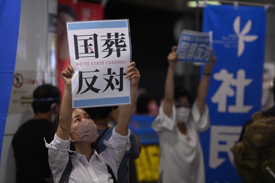 TOKYO, JAPAN - AUGUST 29 : People gather in the Shinjuku district of Tokyo, Japan, on August 29, 2022 to express their opposition to a state funeral for former Prime Minister Shinzo Abe who was shot dead in the street during a political rally on July 8 in Nara city. (Photo by David Mareuil/Anadolu Agency via Getty Images)