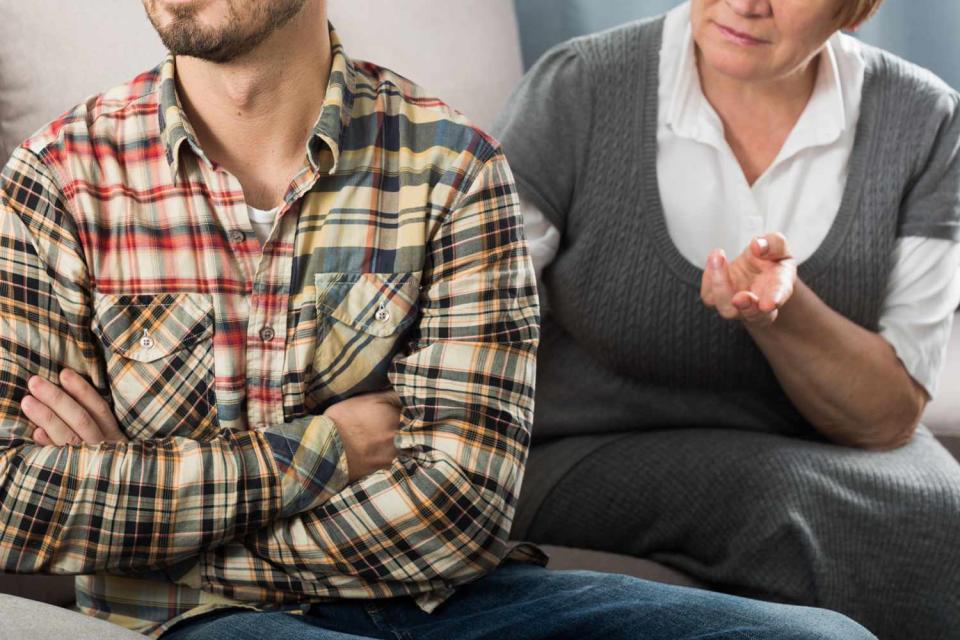 <p>Getty</p> Aged mother arguing with her adult son at home